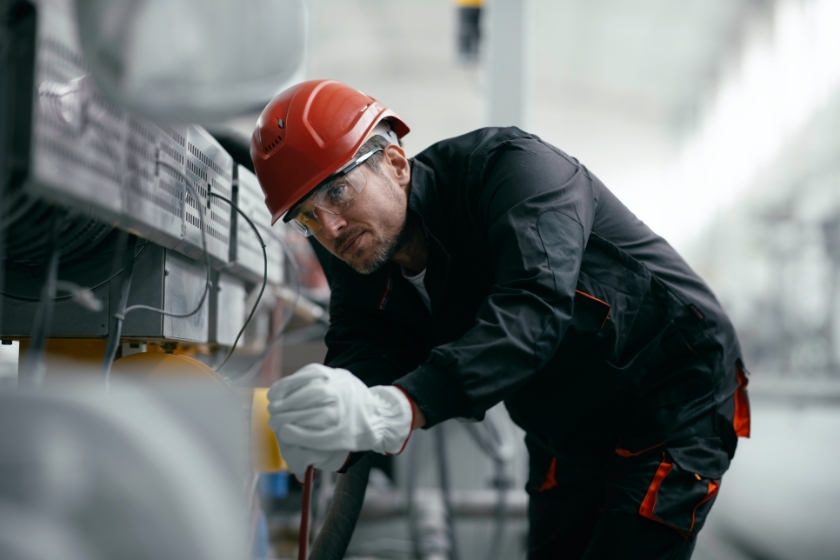 A worker checking the wiring